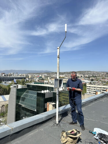 Installing lightning sensor installation to protect crops from hail damage
